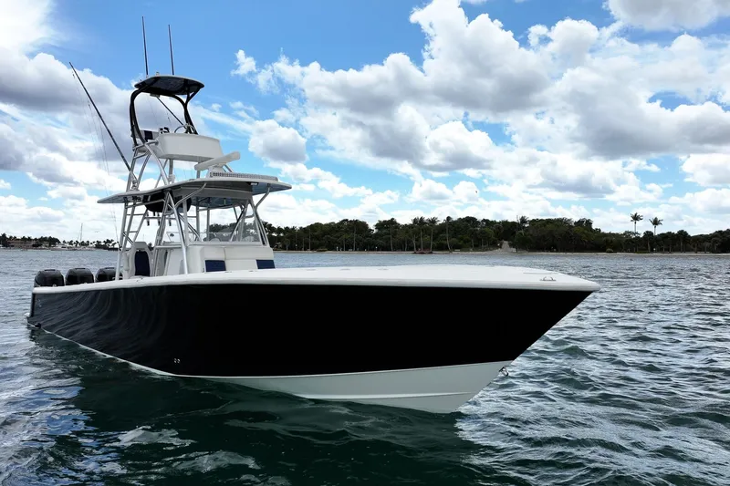 Slide: The Image of 2022 SeaVee 390Z boat on water under cloudy sky. - 2