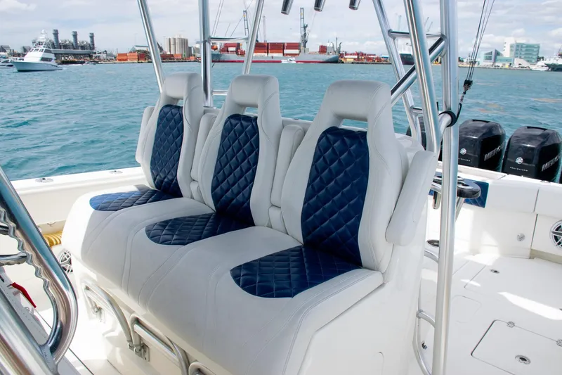 Slide: The Image of Luxury seating on 2022 SeaVee 390Z boat with blue and white upholstery. - 26