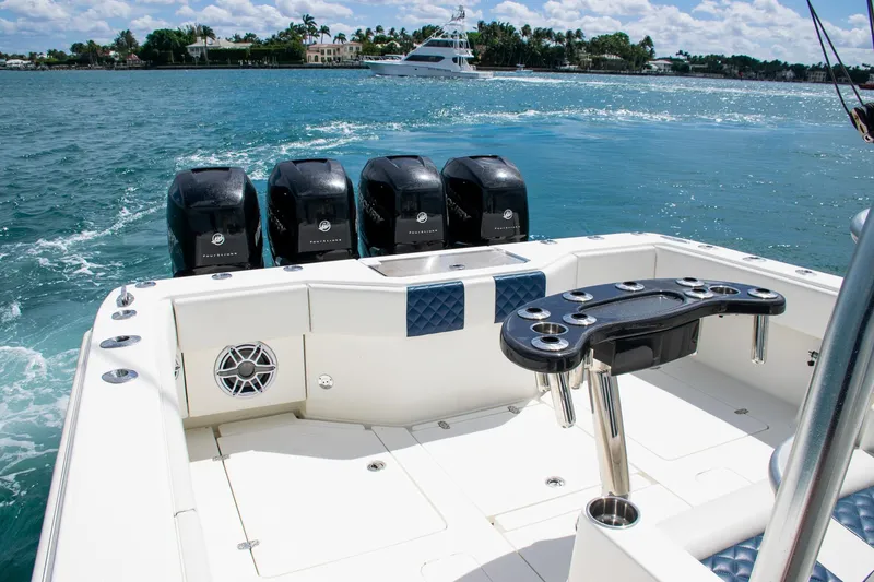 Slide: The Image of 2022 SeaVee 390Z boat with quad outboard engines on a sunny day. - 29