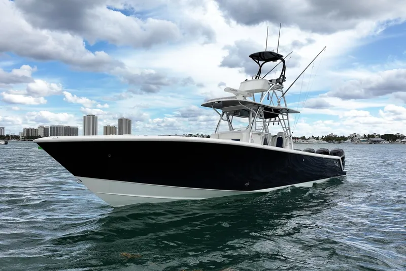 Slide: The Image of 2022 SeaVee 390Z boat on water with city skyline in background. - 3