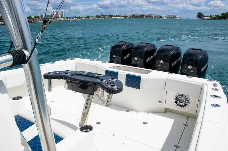 Slide: The Image of 2022 SeaVee 390Z boat with multiple outboard engines on open water. - 30