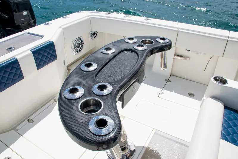 Slide: The Image of 2022 SeaVee 390Z boat with sleek cockpit and cup holders on deck. - 33