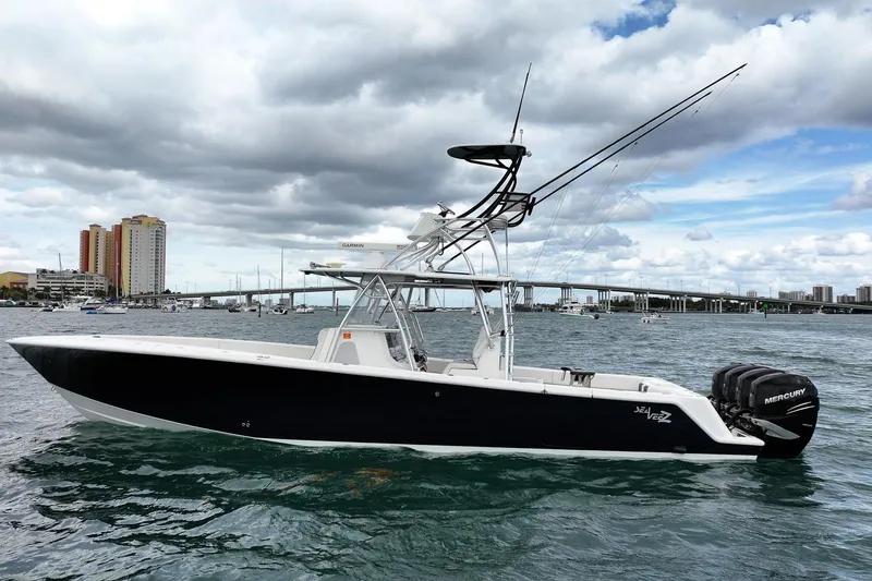 Slide: The Image of 2022 SeaVee 390Z boat with Mercury engines on a scenic waterfront. - 4