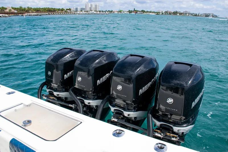 Slide: The Image of Four Mercury outboard engines on a 2022 SeaVee 390Z boat in open water. - 42