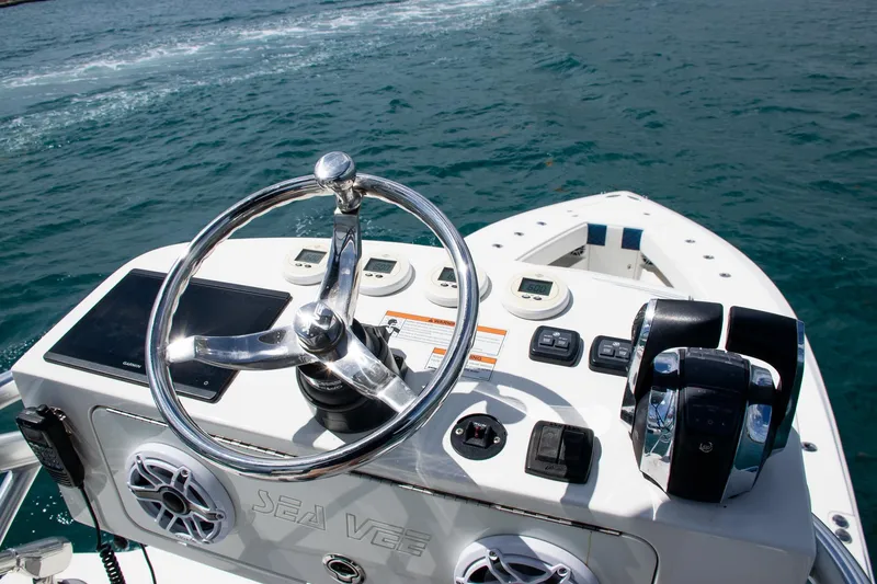 Slide: The Image of Steering console of 2022 SeaVee 390Z boat on open water. - 43