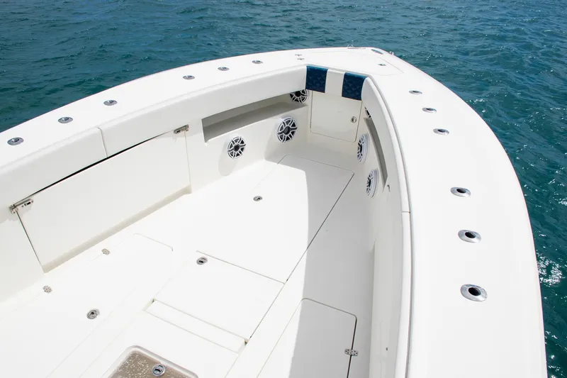 Slide: The Image of 2022 SeaVee 390Z boat deck with speakers, on calm blue water. - 9