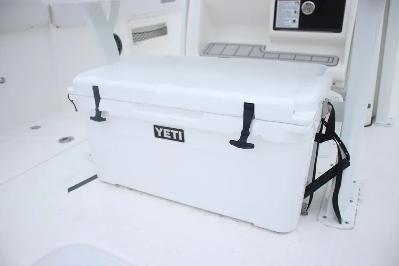 Slide: The Image of White YETI cooler on 2026 Sea Fox 268 Commander boat deck. - 10