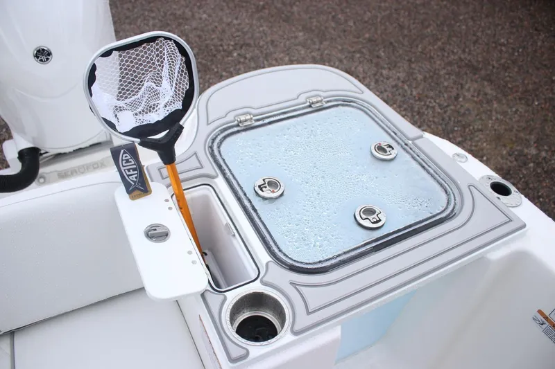 Slide: The Image of Livewell and fishing net on 2026 Sea Fox 268 Commander boat deck. - 11
