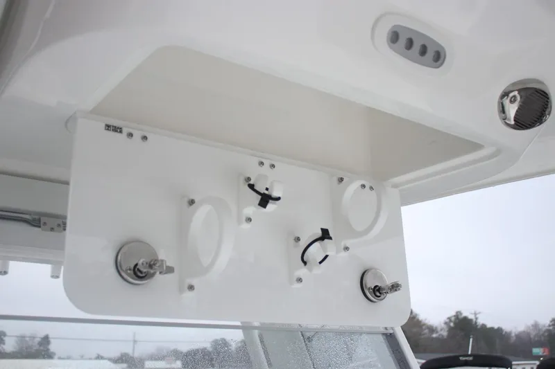 Slide: The Image of 2026 Sea Fox 268 Commander boat dashboard with controls and switches. - 13