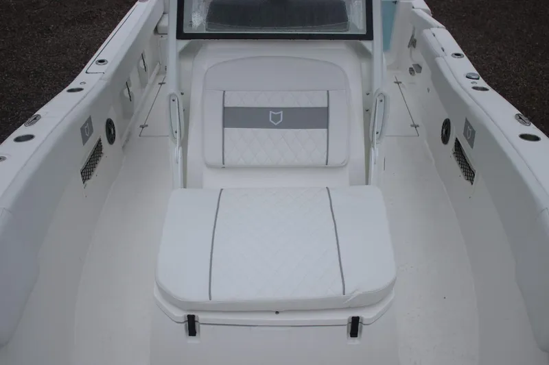 Slide: The Image of 2026 Sea Fox 268 Commander boat interior with white cushioned seating. - 15