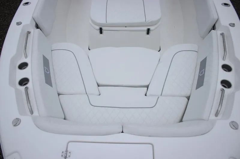 Slide: The Image of 2026 Sea Fox 268 Commander boat interior with white cushioned seating. - 16