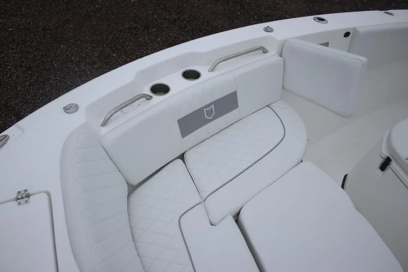 Slide: The Image of 2026 Sea Fox 268 Commander boat interior with white cushioned seating and cup holders. - 17