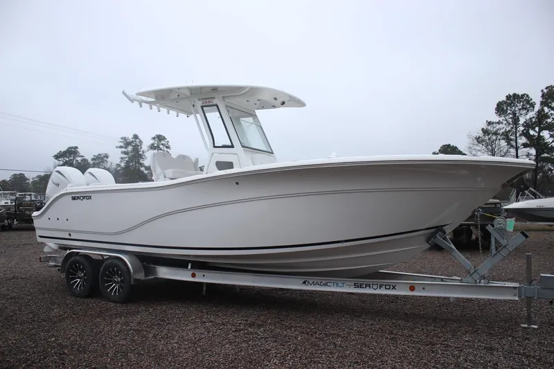 Slide: The Image of 2026 Sea Fox 268 Commander boat on trailer, side view, overcast day. - 20