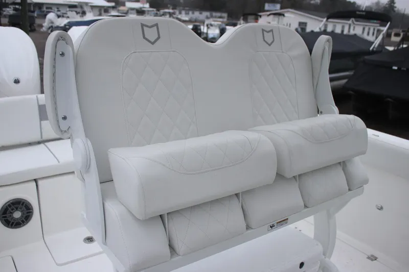 Slide: The Image of 2026 Sea Fox 268 Commander boat seating with white cushioned upholstery and diamond stitching. - 6