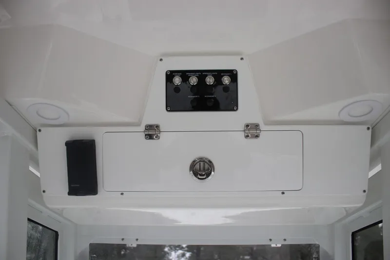 Slide: The Image of Interior view of 2026 Sea Fox 268 Commander boat console with controls and storage. - 8