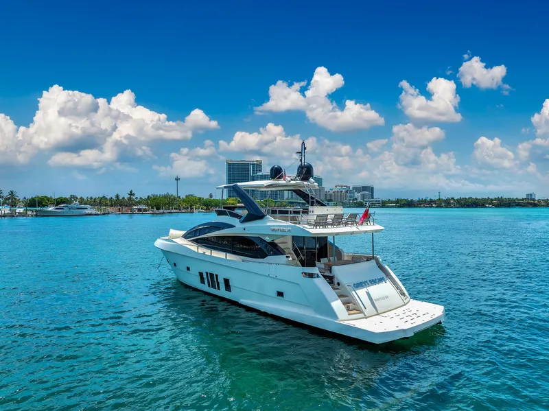 Slide: The Image of Astondoa 72 GLX 2013 yacht on clear blue water under a sunny sky. - 10