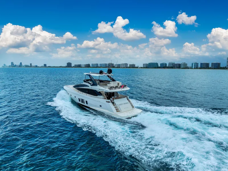 Slide: The Image of Astondoa 72 GLX yacht cruising on open water, 2013 model, under a clear blue sky. - 14