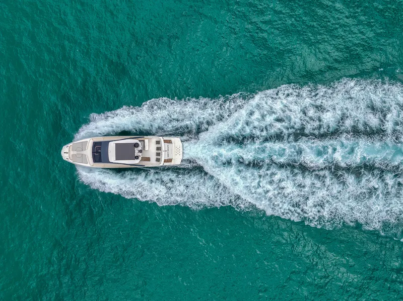Slide: The Image of Aerial view of 2013 Astondoa 72 GLX yacht cruising on turquoise water. - 20