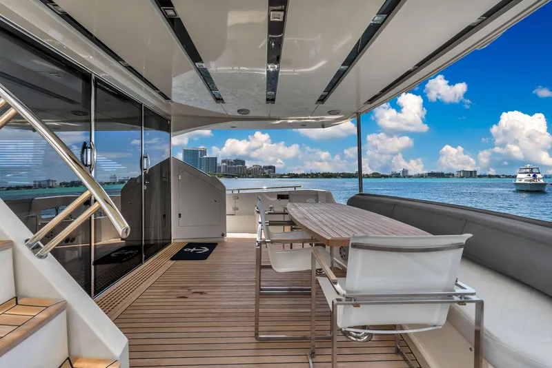 Slide: The Image of Astondoa 72 GLX 2013 yacht deck with dining area, overlooking serene ocean view. - 37