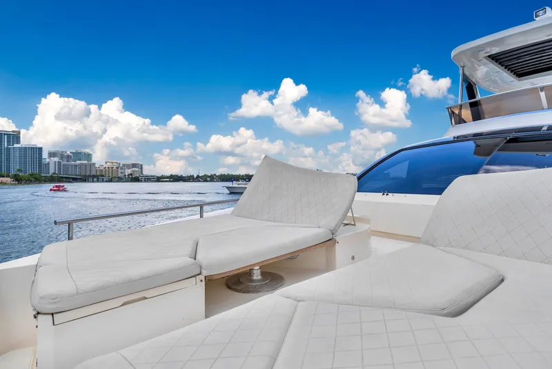 Slide: The Image of Luxurious 2013 Astondoa 72 GLX yacht with sun loungers, scenic waterfront view. - 43