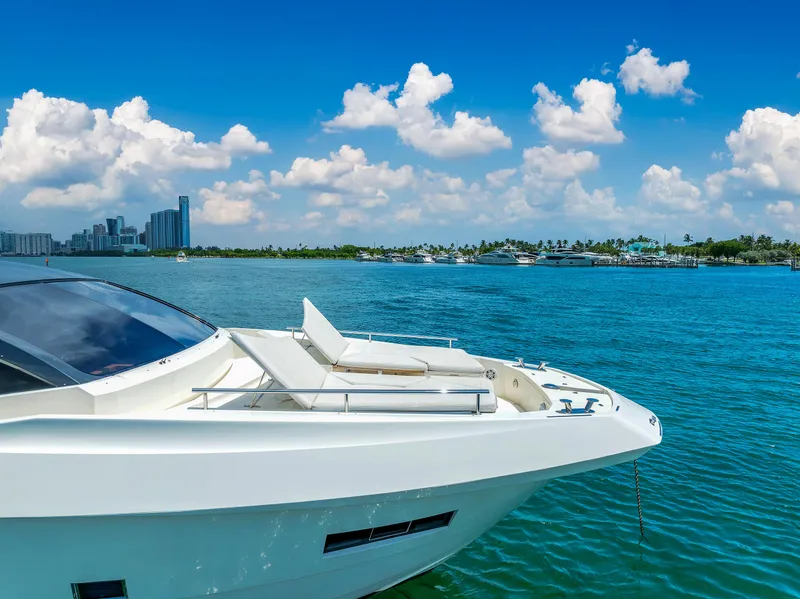 Slide: The Image of Astondoa 72 GLX yacht on blue water with city skyline, 2013 model. - 6