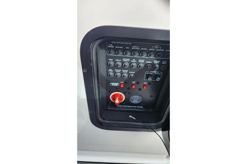 Slide: The Image of Control panel of a 2017 MasterCraft X23 boat, featuring various switches and indicators. - 16