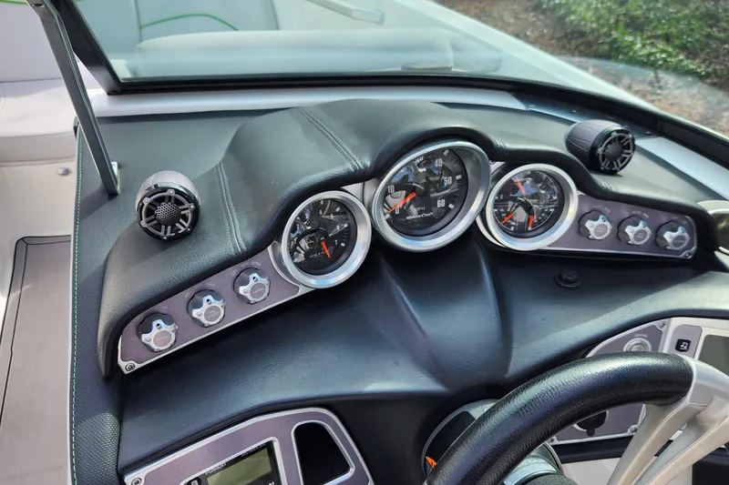 Slide: The Image of Dashboard of a 2017 MasterCraft X23 boat with gauges and controls. - 17
