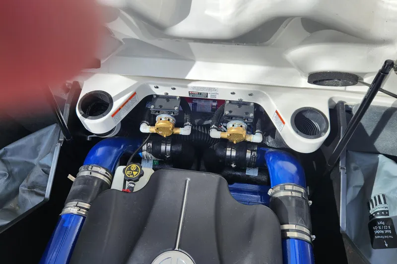 Slide: The Image of Engine compartment of a 2017 MasterCraft X23 boat, showcasing mechanical components. - 19