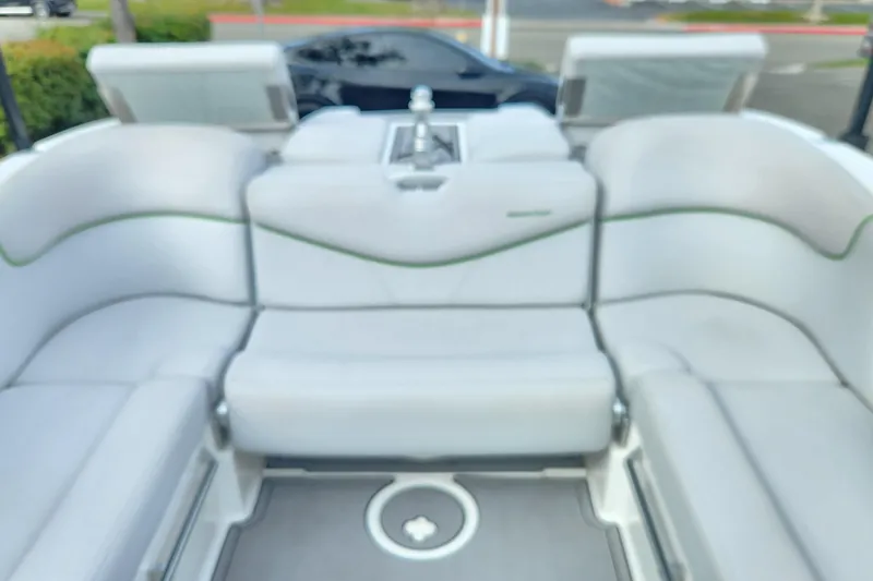 Slide: The Image of 2017 MasterCraft X23 boat interior with plush seating and modern design. - 26