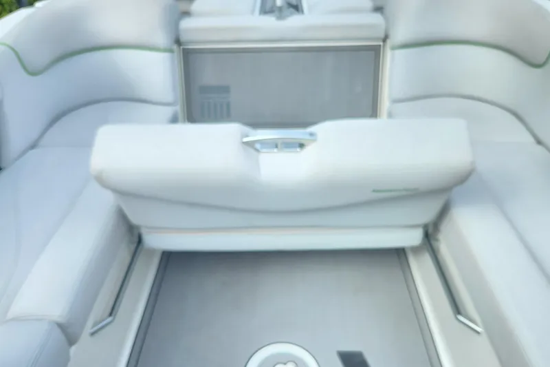 Slide: The Image of Interior seating of a 2017 MasterCraft X23 boat, featuring white upholstery. - 6