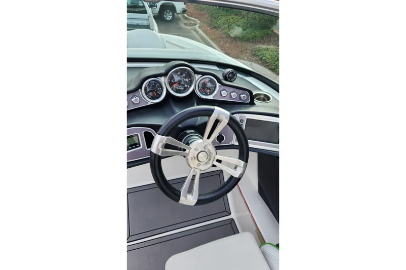 Slide: The Image of Steering wheel and dashboard of 2017 MasterCraft X23 boat. - 9