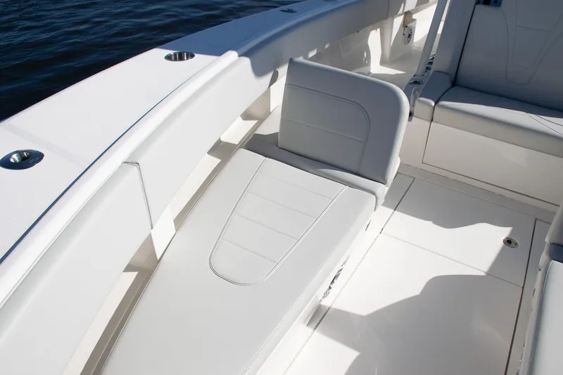 Slide: The Image of 2022 SeaVee 322Z boat interior with sleek white seating and deck. - 15