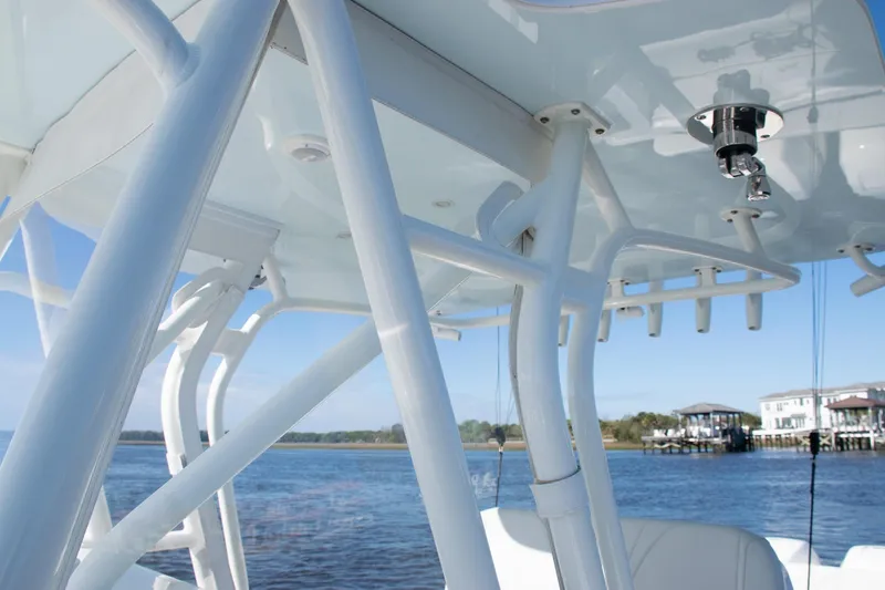 Slide: The Image of 2022 SeaVee 322Z boat with white framework and water view in the background. - 17