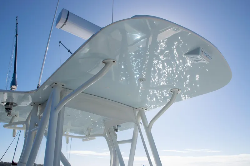 Slide: The Image of 2022 SeaVee 322Z boat's sleek T-top design against a clear blue sky. - 18