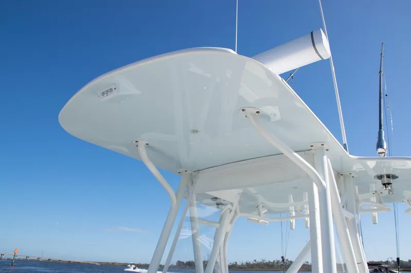 Slide: The Image of 2022 SeaVee 322Z boat's T-top against clear blue sky. - 24