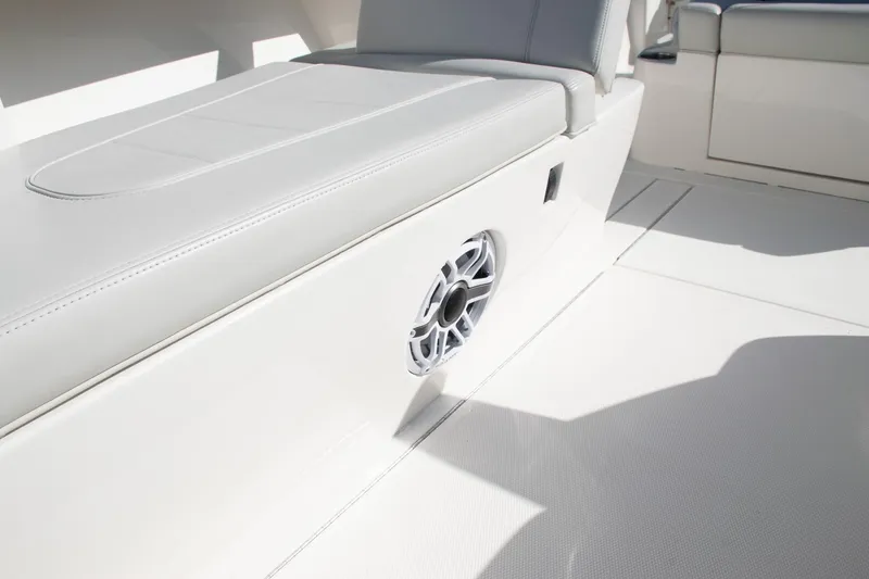 Slide: The Image of 2022 SeaVee 322Z boat interior with cushioned seating and built-in speaker. - 25
