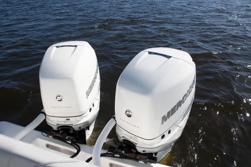 Slide: The Image of Twin Mercury outboard engines on a 2022 SeaVee 322Z boat in open water. - 27