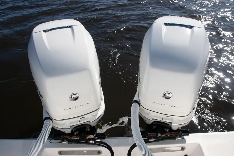 Slide: The Image of Twin Mercury FourStroke engines on a 2022 SeaVee 322Z boat, floating on water. - 30