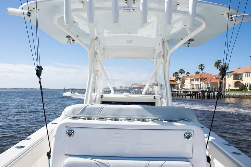 Slide: The Image of 2022 SeaVee 322Z boat on water, featuring sleek design and coastal backdrop. - 39