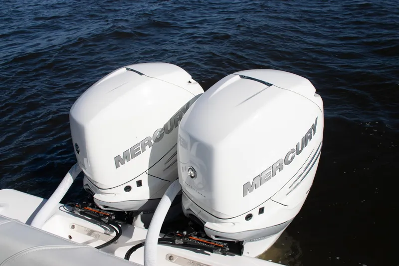 Slide: The Image of Twin Mercury outboard engines on a 2022 SeaVee 322Z boat in water. - 41