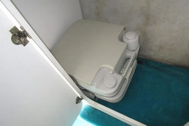 Slide: The Image of Portable toilet inside 1995 Wellcraft 236 Eclipse boat compartment. - 10