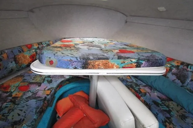 Slide: The Image of Interior cabin of 1995 Wellcraft 236 Eclipse boat with colorful upholstery and cushions. - 13
