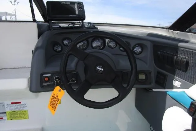 Slide: The Image of Steering console of a 1995 Wellcraft 236 Eclipse boat with gauges and navigation equipment. - 14