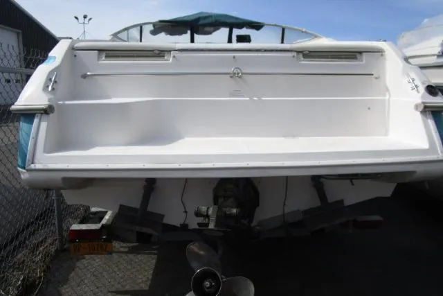 Slide: The Image of 1995 Wellcraft 236 Eclipse boat, rear view, docked outdoors. - 17