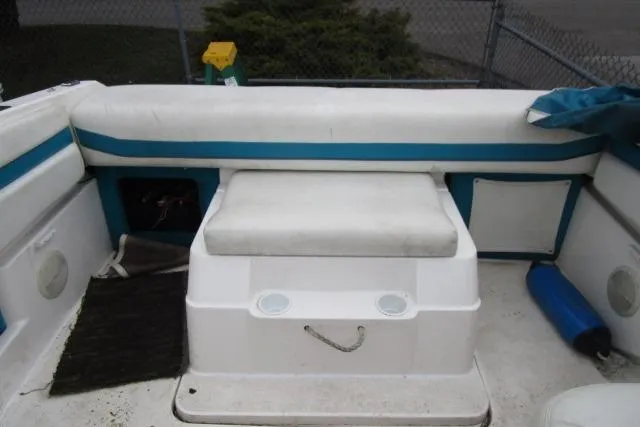 Slide: The Image of 1995 Wellcraft 236 Eclipse boat interior with white and blue seating. - 7