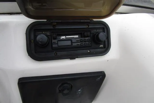 Slide: The Image of 1995 Wellcraft 236 Eclipse boat dashboard with JVC stereo system. - 9