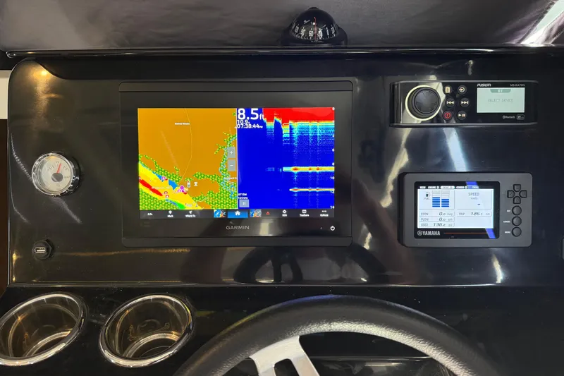 Slide: The Image of Dashboard of 2020 Jeanneau NC 1095 with Garmin navigation and Yamaha controls. - 12