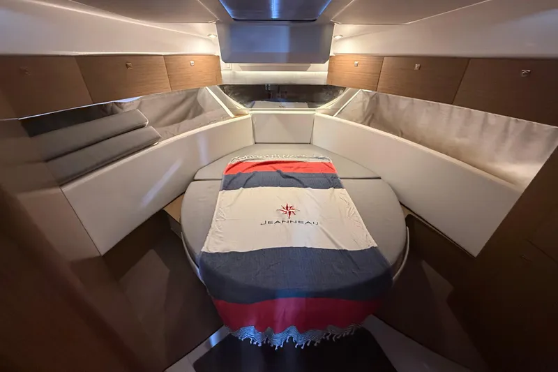Slide: The Image of Cozy cabin interior of 2020 Jeanneau NC 1095 boat with stylish bedding. - 5