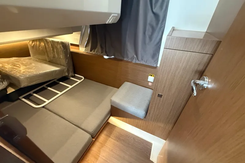 Slide: The Image of Interior cabin of 2020 Jeanneau NC 1095 boat with seating and storage. - 7