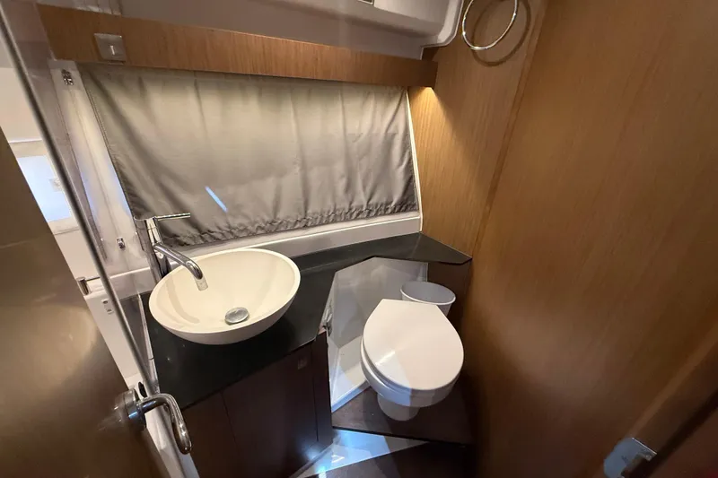 Slide: The Image of 2020 Jeanneau NC 1095 boat bathroom with modern sink and toilet. - 9